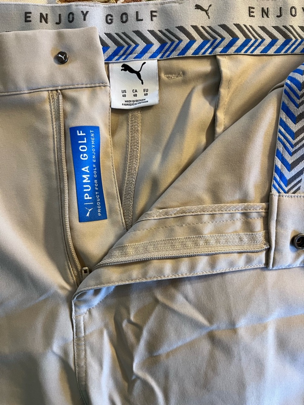 Puma Men’s Light Khaki Golf Chinos. 40” waist, 20” length w/ zippered pockets